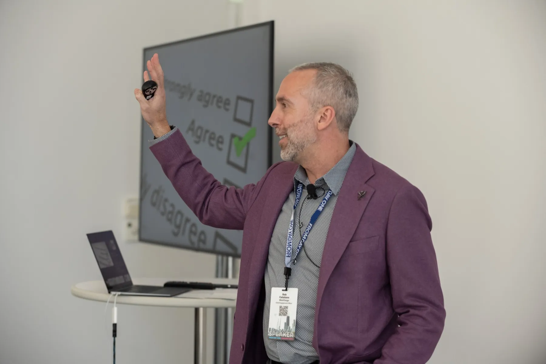 Rob Catalano on stage, speaking to a conference audience